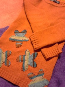 oranssi-villapaita-applikoidut-kukat